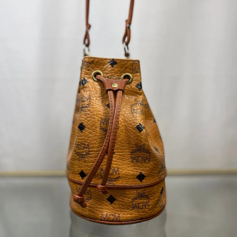 Women's bucket bag top designers -MCM Cognac Visetos Coated Canvas Drawstring Bucket Bag